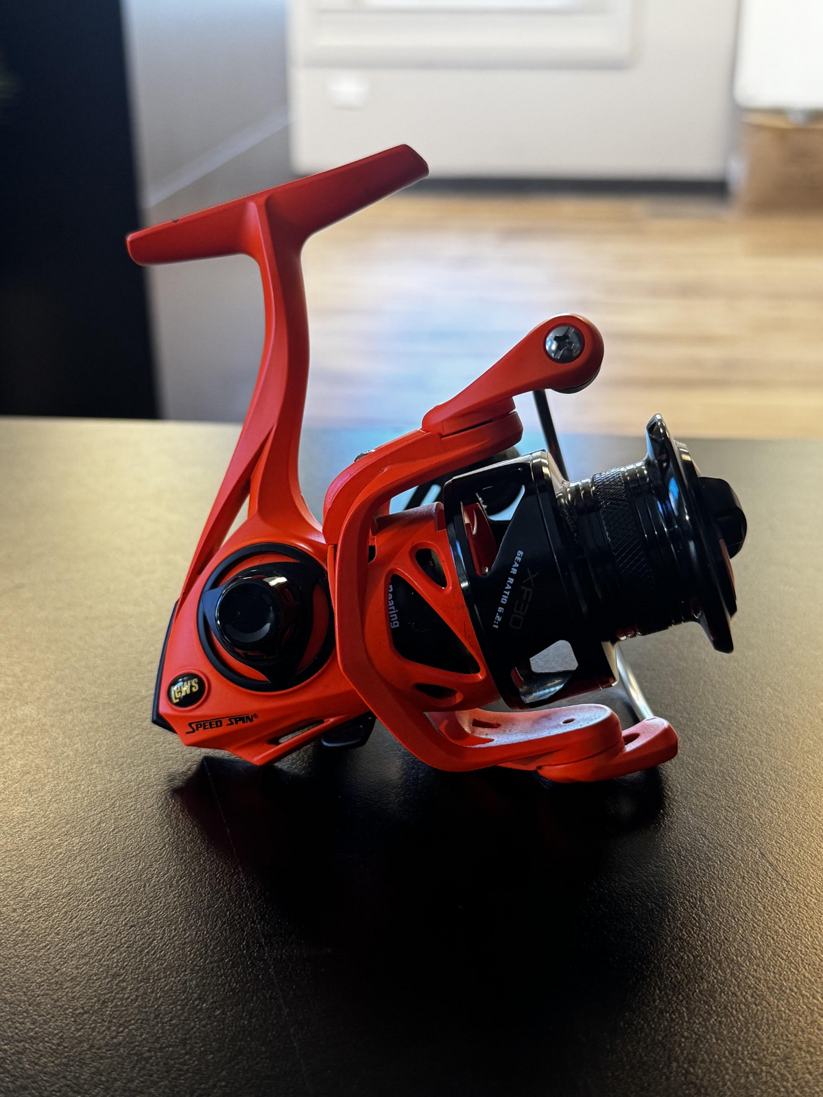 Lew’s Speed Spin XF30 spinning reel in red and black, slightly used